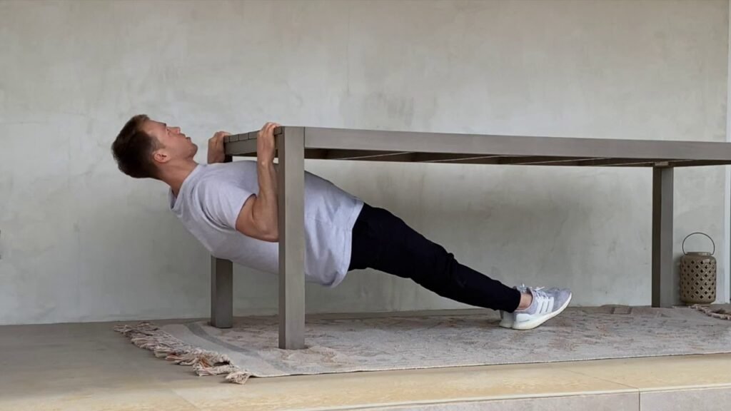 Man doing inverted rows