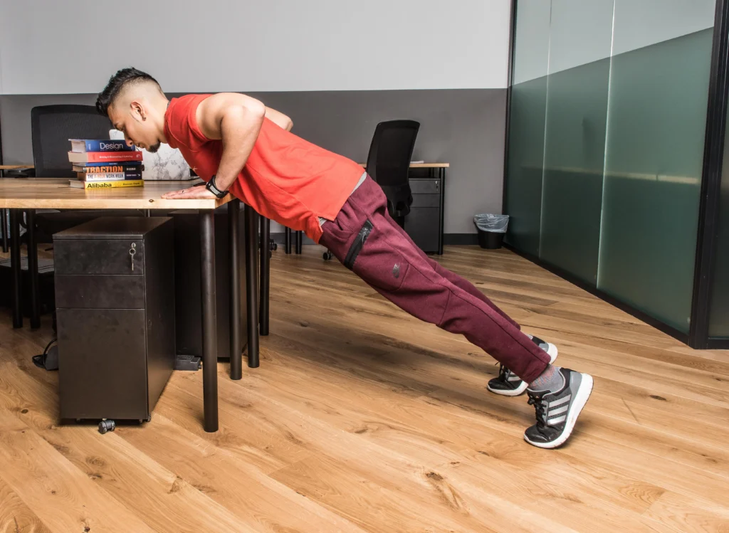 man doing table pushups