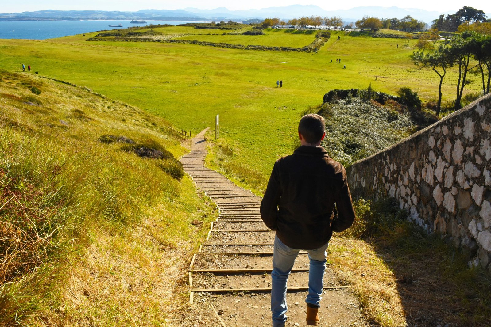 man walking in countryside